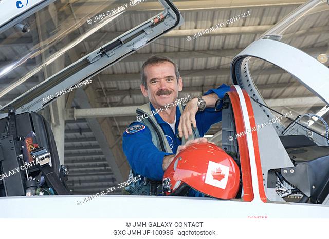 Canadian Space Agency astronaut Chris Hadfield, Expedition 34 flight engineer and Expedition 35 commander, pauses for a photo while preparing to fly with NASA...