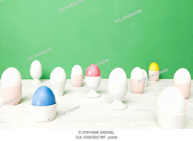 Colorful Easter eggs in egg cups