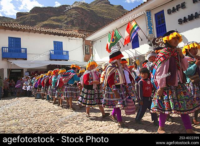 Indigenous people of Andean villages wearing traditional dress during a parade at the historic center of Pisac town, Cusco Province, Incas Sacred Valley, Peru