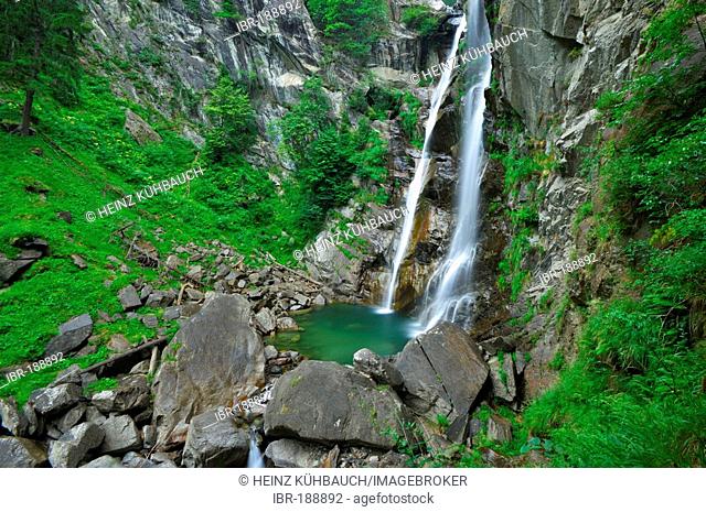 Waterfall falling into a litle lake, long term exposure, Valley of Passeier, Trentino, South Tyrol, Italy