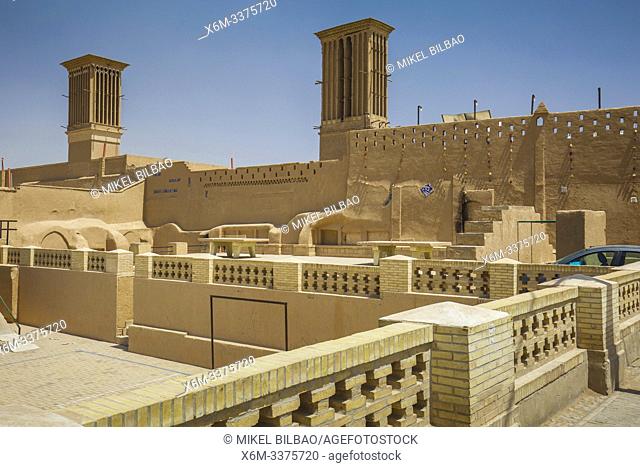 Windtowers or badgirs (traditional architectural element to create natural ventilation) and city wall. Yazd, Iran, Asia