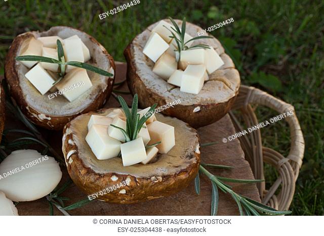 Porcini mushrooms filled with scamorza cheese and rosemary