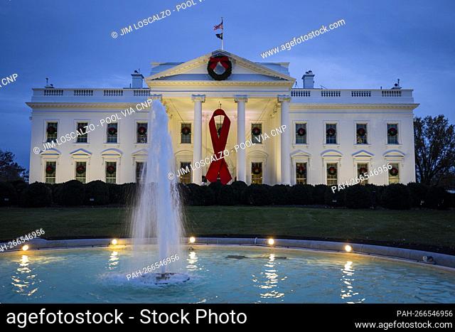 The White House hangs a giant red ribbon on the North Portico to recognize World AIDS Day in Washington, DC, USA, 01 December 2021