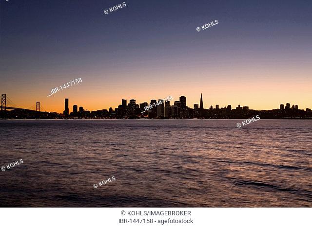 View from Treasure Island to San Francisco skyline, Oakland Bay Bridge, at twilight, California, United States of America