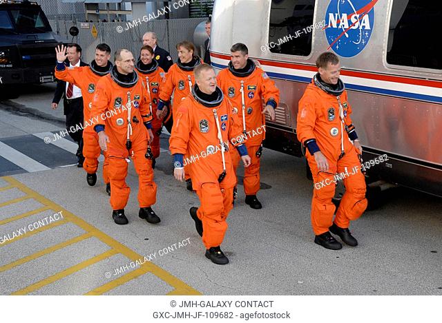 After suiting up, the STS-126 crewmembers exit the Operations and Checkout Building to board the Astrovan, which will take them to launch pad 39A for the launch...
