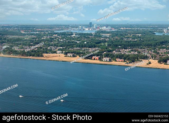 Aerial view Dutch city Almere with residential area between lake Markermeerand lake Gooimeer