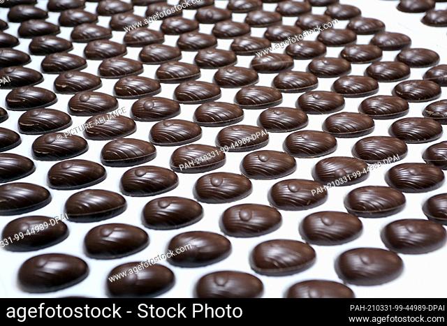 10 March 2021, Saxony-Anhalt, Wernigerode: Millions of chocolate products, such as filled chocolate eggs, come off the production line at Wergona