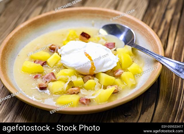 Czech traditional cabbage soup with smoked meat and potatoes