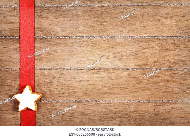 cinnamon star on a red ribbon