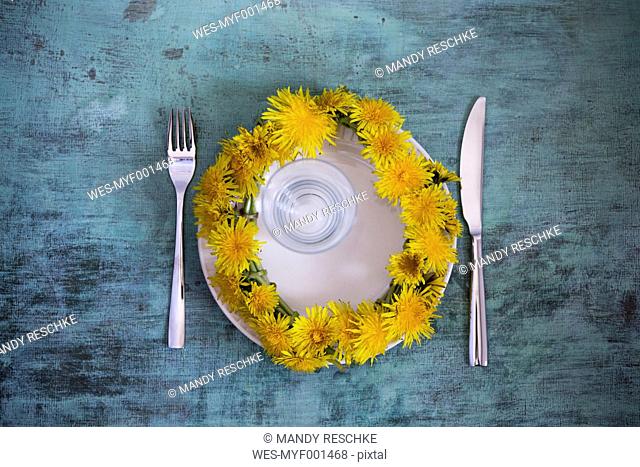 Wreath of dandelions on plate