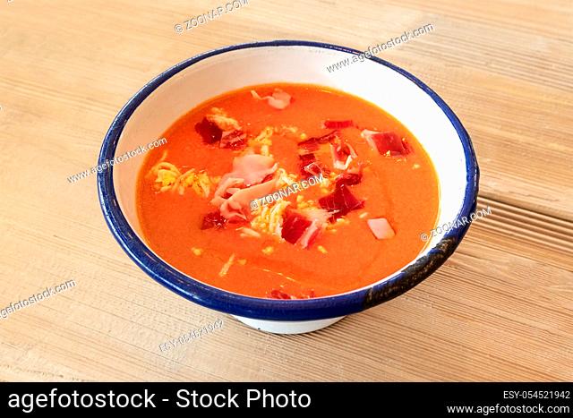 Salmorejo, Spanish cold tomato soup in a rustic bowl