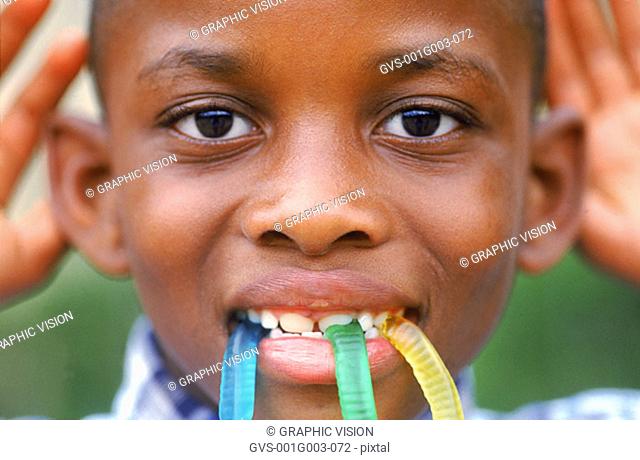 Close-up of a young boy making a funny face