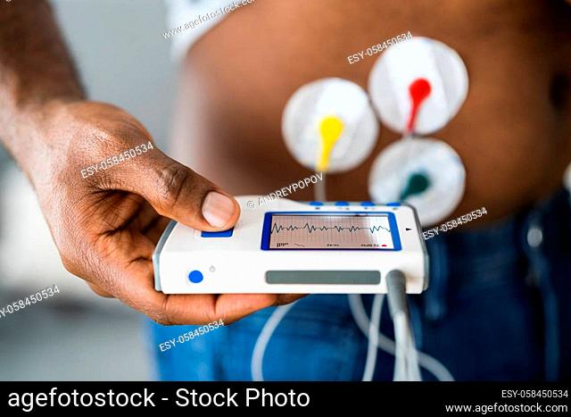 African American Patient Using Electrodes Diagnostic Device