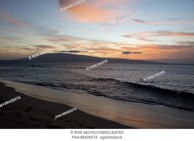 Sunset looking towards the Hawaiian island of Lanai from Kaanapali Beach, Maui, Hawaii on Thursday, February 23, 2017. Most of Lanai is owned by the tech...