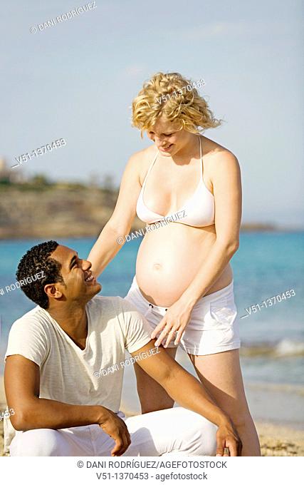 Interracial couple at the beach