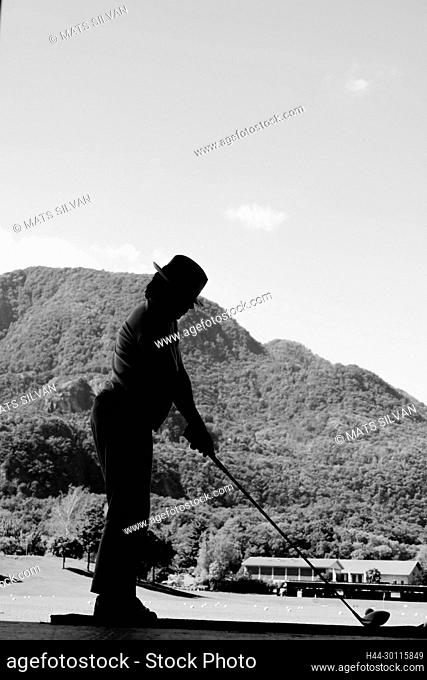 Golfer with Golf Swing on Driving Range in Losone, Ticino in Switzerland
