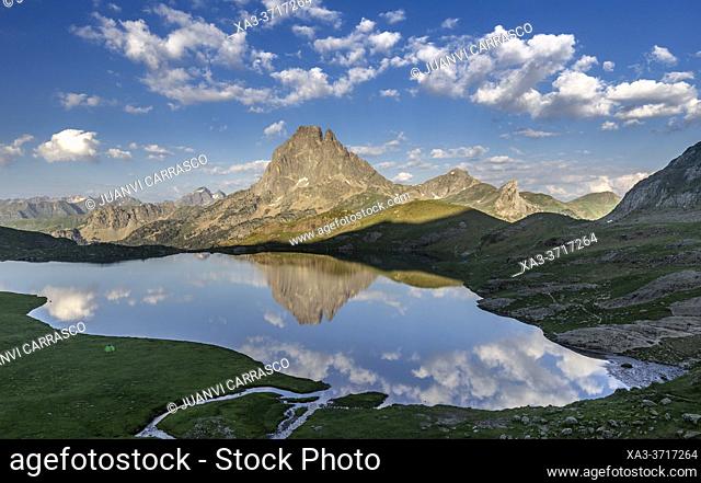 Midi d'Ossau peak reflecting into Gentau lake, Pyrenees national park, France