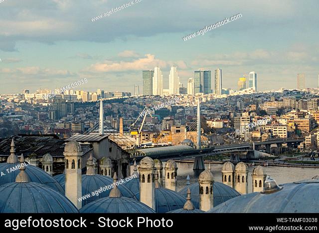 Turkey, Istanbul, Minarets of Suleymaniye Mosque with bridge and city buildings in background