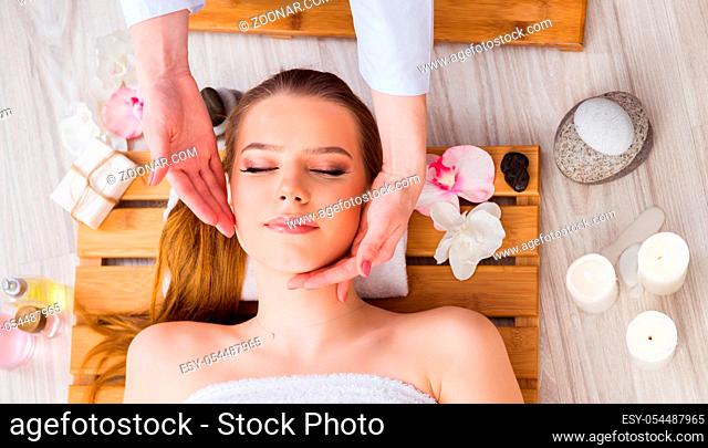 The young woman during spa procedure in salon