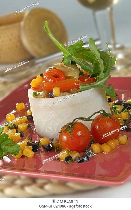 Sliced cod salad with escalivada roasted sweet peppers and aubergines, kaki persimon, and black olives from Seville