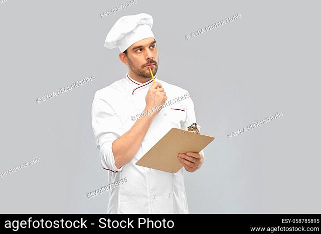 thinking male chef with clipboard