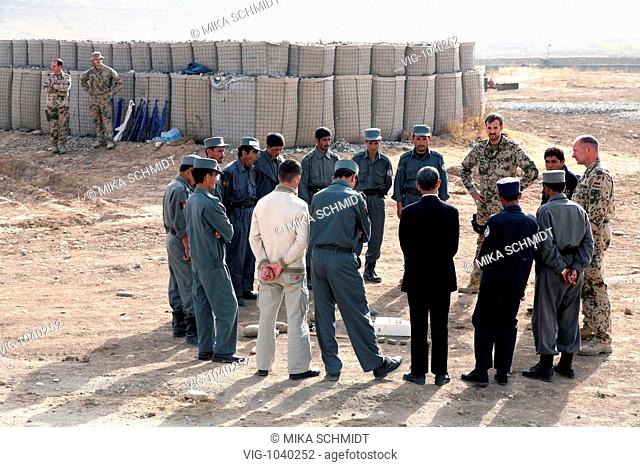 German ISAF- Stabsfeldwebel and Oberfeldwebel at a basic course for and with a group of afghan police men in house searching in the PRT Feyzabad