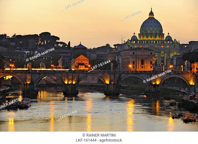 Ponte Sant'Angelo at dusk, with St. Peter's Basilica in the background, Rome, Italy