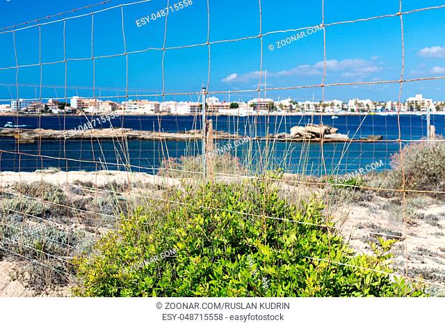 Sea view and beach through the fence, Mallorca, Spain
