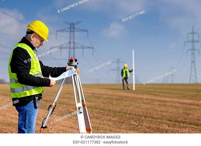 Geodesist measure land on construction site