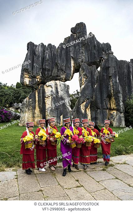 Sani minority girls with traditional dress at Stone Forest or Shilin, Kunming, Yunnan Province, China, Asia, Asian, East Asia, Far East