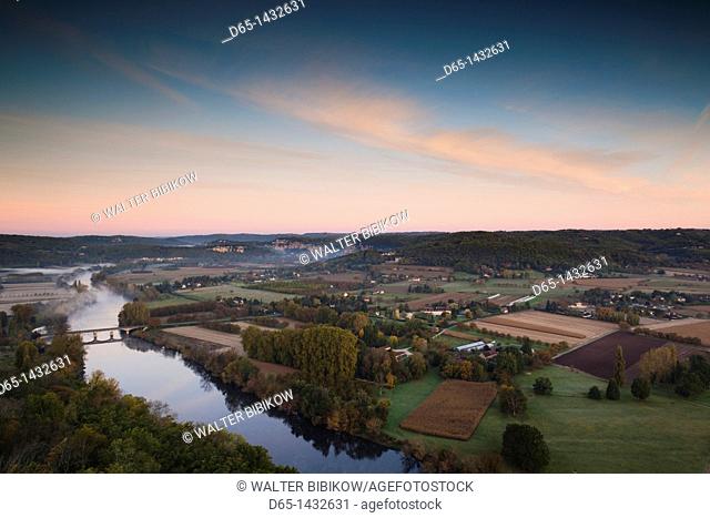 France, Aquitaine Region, Dordogne Department, Domme, elevated view of the Dordogne River Valley in fog from the Belvedere de la Barre, dawn