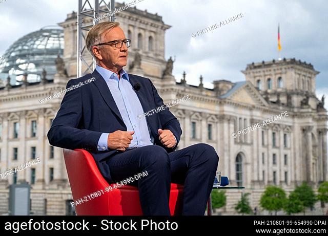 01 August 2021, Berlin: Dietmar Bartsch, top candidate of the Left Party, sits on the terrace of the Marie-Elisabeth-Lüders-Haus during the ARD summer interview