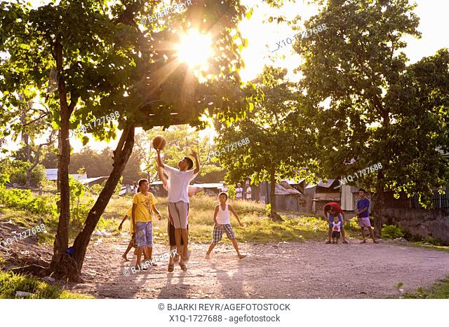 Filipino boys playing basketball  Lapu-Lapu City, Metro Cebu, Mactan Island, Visayas, Philippines