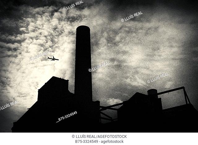 Silhouette with clouds and a plane. Lots Road Power Station. Londes, UK, Europe
