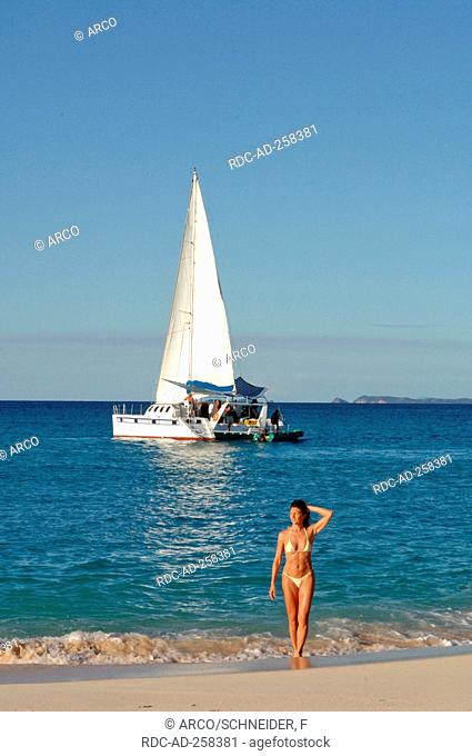 Woman at beach Isle of Nosy Be Madagascar catamaran
