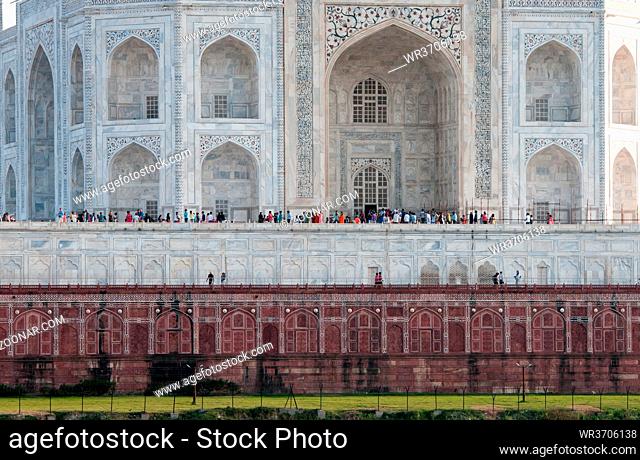 Agra, India - March 15 2017: Famous marble palace of Taj Mahal, dedicated to love, with tourists around, in Agra city, india