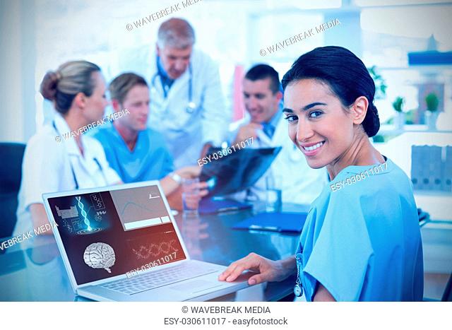 Composite image of beautiful smiling doctor typing on keyboard with her team behind