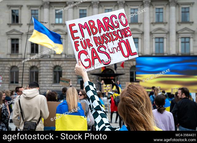 Berlin, Germany, Europe - A woman protests for an embargo of Russian gas and oil at a peaceful demonstration according to the motto ""Stand with Ukraine"" at...