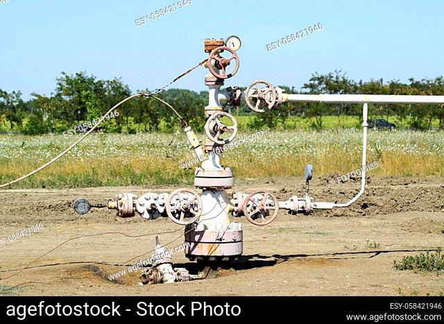 Well for oil and gas production. Oil well wellhead equipment. Oil production