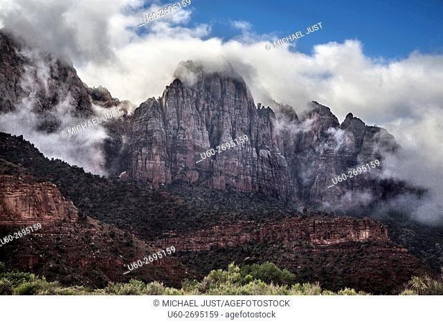 Fog lifts in Zion Canyon after a morning of rain at Zion National Park, Utah