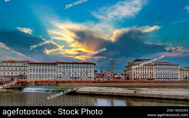 FLORENCE, TUSCANY/ITALY - OCTOBER 20 : Weir across the River Arno in Florence on October 20, 2019. Unidentified people