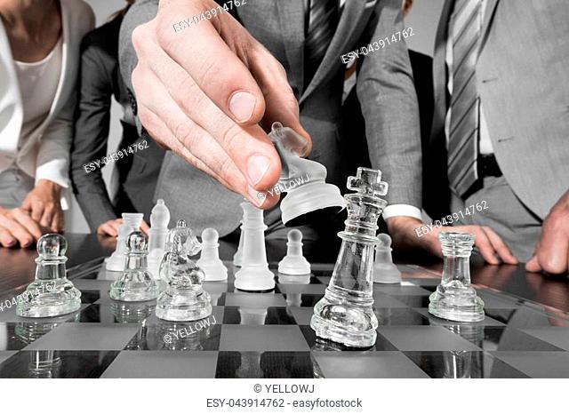 Business people team playing chess, business strategy concept