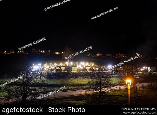 18 December 2023, Baden-Württemberg, St. Peter: Farmers protest against the increase in fuel prices for agricultural businesses with their tractors during a...