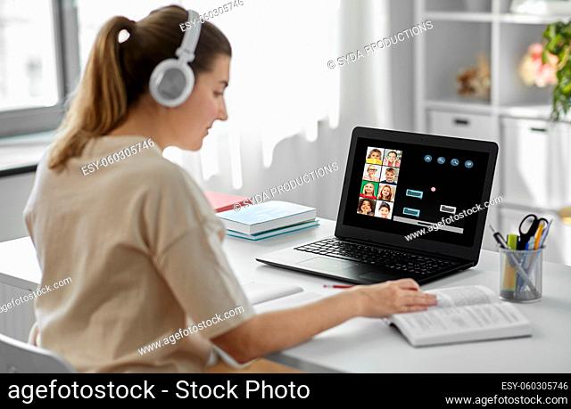 female teacher with laptop having online class