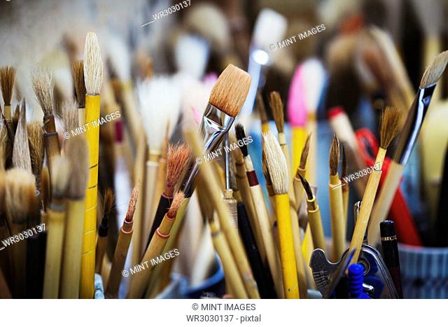 Close up of a selection of paintbrushes in a Japanese porcelain workshop