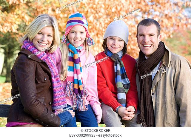 Family outdoors at park smiling selective focus
