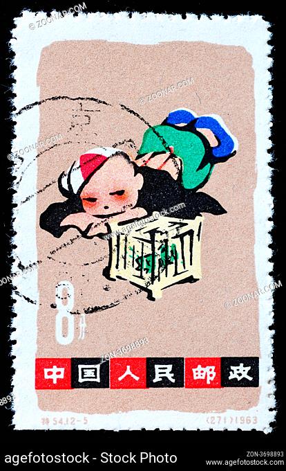CHINA - CIRCA 1963: A stamp printed in China shows playing boy, circa 1963 CHINA - CIRCA 1963: A stamp printed in China shows playing boy, circa 1963