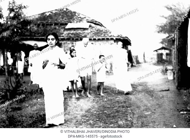 Kasturba Gandhi , her grandson Kahandas , Mahatma Gandhi from r to l and others walking at Sevagram Ashram , 1939, f Sushila Nayar NO MR