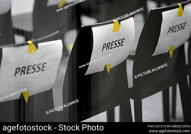 19 December 2023, Schleswig-Holstein, Itzehoe: Chairs marked ""Press"" are available for media representatives in the audience area in the courtroom at the...