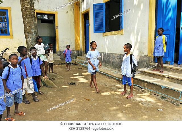 pupils playing skipping in the playground of the primary school in the village of Praia das Conchas, in the northern part of Sao Tome Island